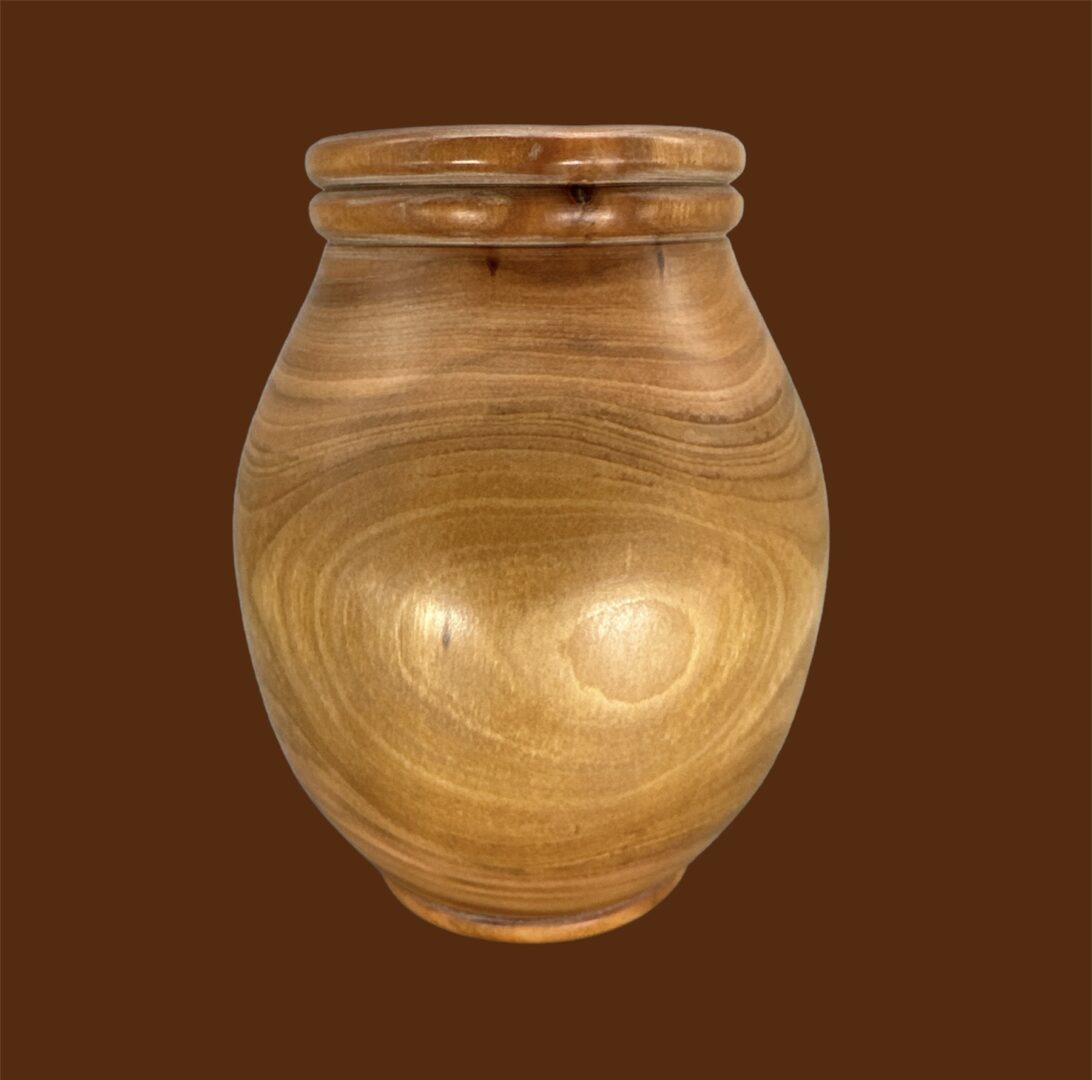 A wooden vase with brown background
